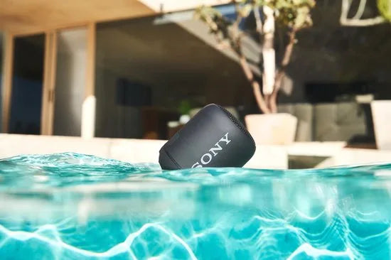 Compact Bluetooth speaker with strap