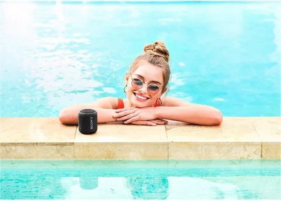 Compact Bluetooth speaker with strap